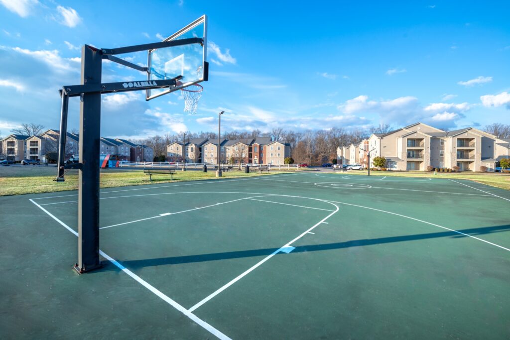 Outdoor sport court with basketball hoops