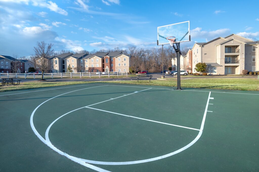 Outdoor sport court with basketball hoops