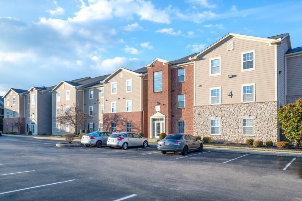 Apartment buildings exterior with cars parked in front