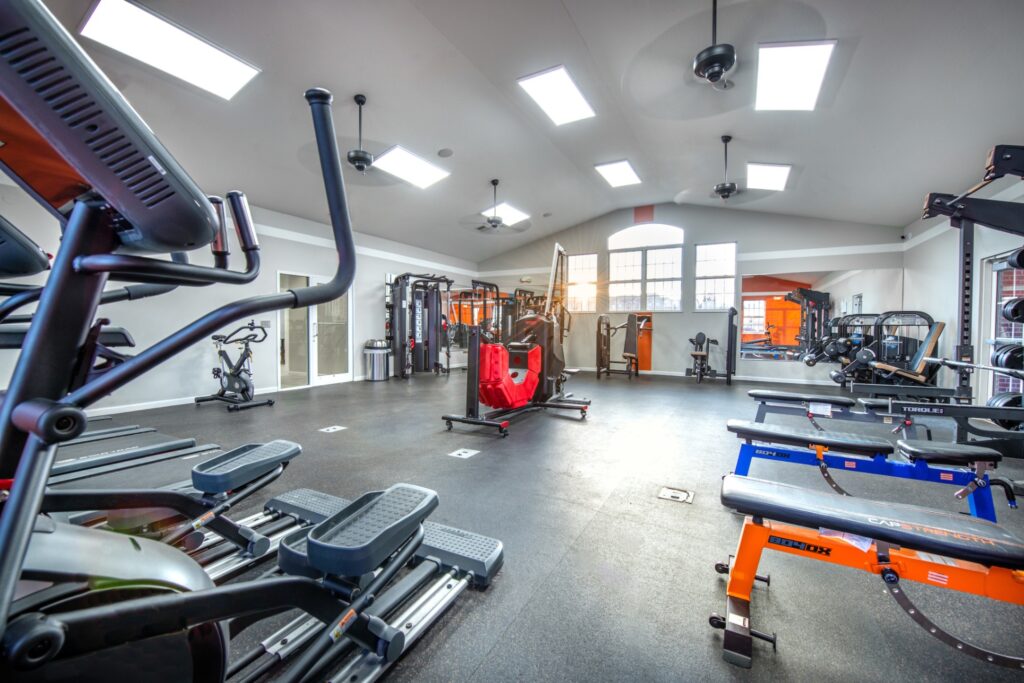 Fitness center with strength training equipment and cardio machines