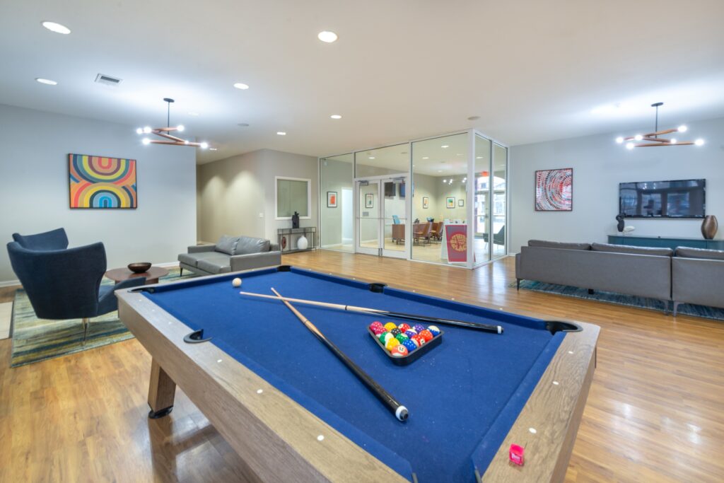 Clubhouse lounge with Billiards table and sofas around a TV