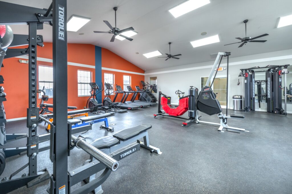 Fitness center with strength training equipment and cardio machines