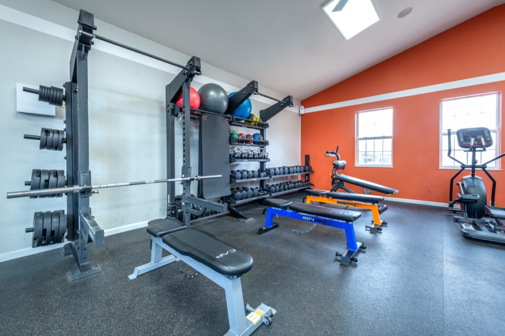 Fitness center with strength training equipment and cardio machines