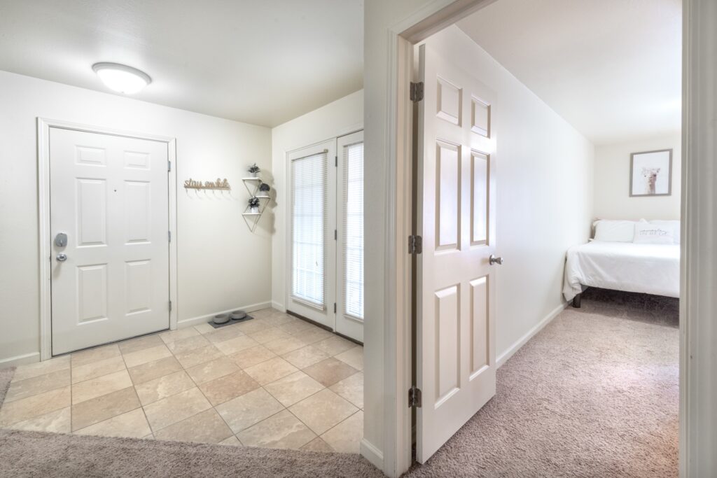 tile foyer with several doors