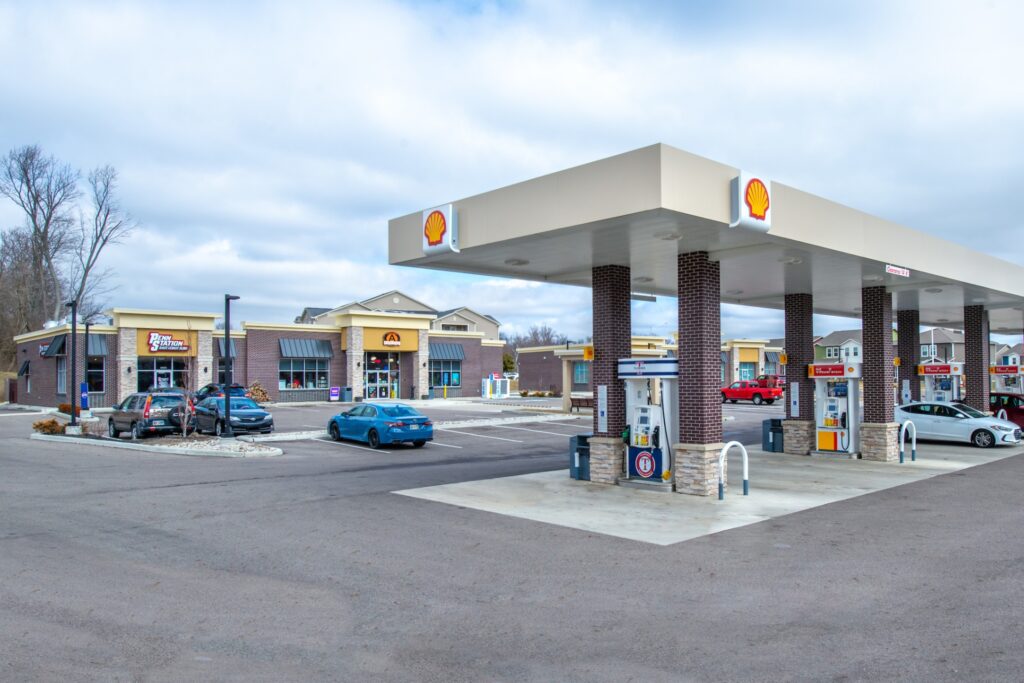 Gas station parking lot with covered gas pumps